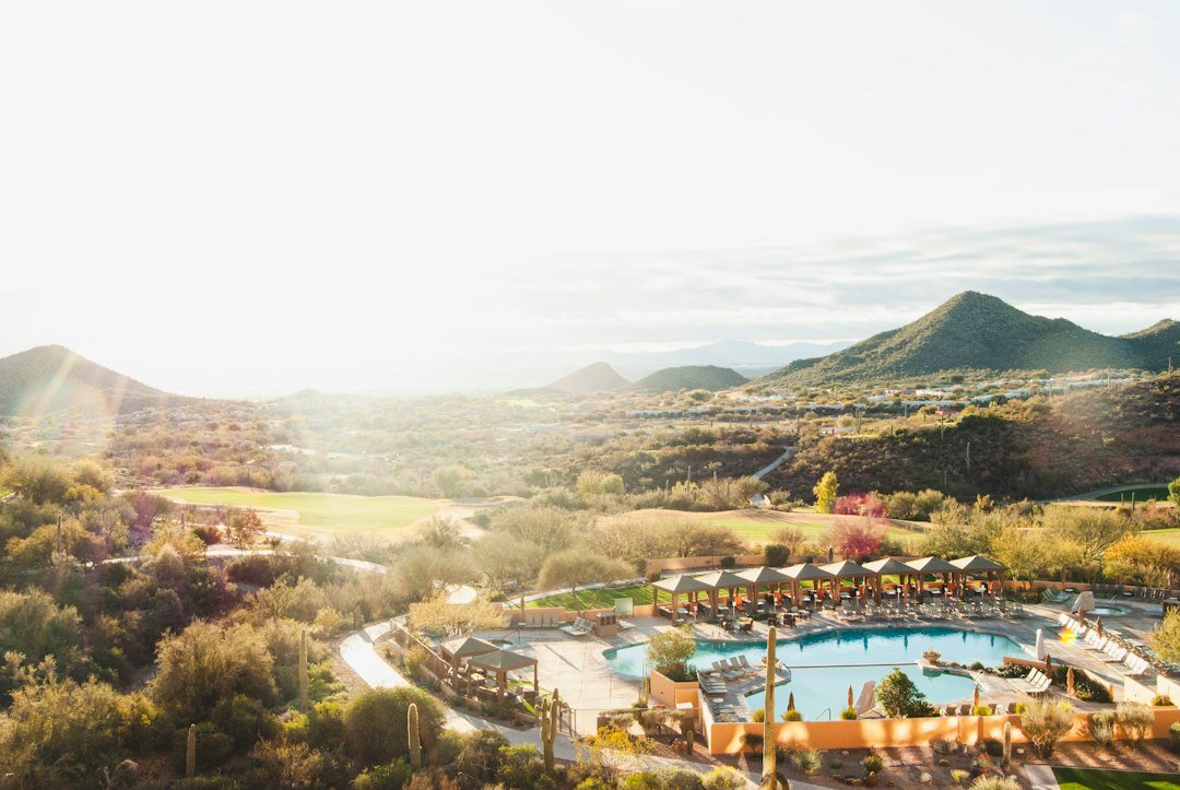 Resort-style community pool and clubhouse patio at a mountain ranch club