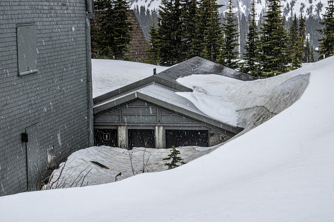 Mountain-contemporary luxury home with steep snow-shedding roof in a Park City community